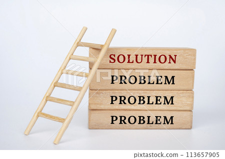 Wooden block with text, problem and solutions. Solutions to problems concept 113657905