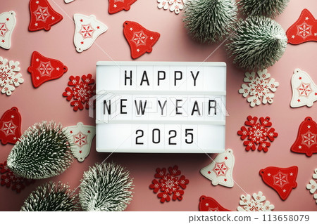 Happy New Year 2025 word in light box on pink background 113658079