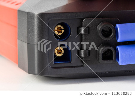 Connectors in the power bank for connecting clamps to start the engine, close-up 113658293