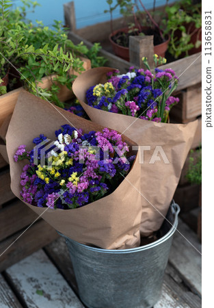 Bouquet colorful flowers Limonium or Statice (sea-lavender, caspia or marsh-rosemary) in craft paper Bouquet colorful flowers Limonium or Statice (sea-lavender, caspia or marsh-rosemary) in craft paper 113658831