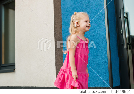 Child girl with hearing aids and cochlear implants having fun outdoor speak and playing. Copy space. Diversity inclusion concept. Child girl with hearing aids and cochlear implants having fun outdoor speak and playing. Copy space. Diversity inclusion concept. 113659605