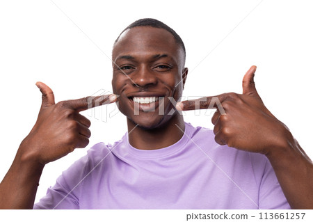 close-up portrait of a young proud american man dressed in a light lilac t-shirt on a white 113661257