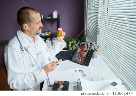 Doctor recommending supplements to patient in telemedicine session Doctor recommending supplements to patient in telemedicine session 113661474