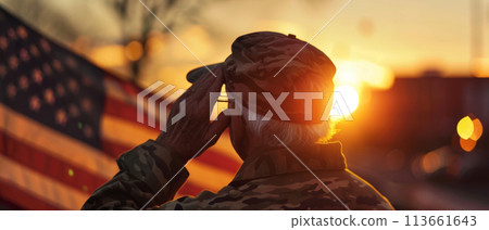 With the sun setting, a veteran in uniform salutes the American flag, embodying honor and remembrance. With the sun setting, a veteran in uniform salutes the American flag, embodying honor and remembrance. 113661643