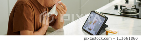 Coughing and sneezing man video calling doctor 113661860