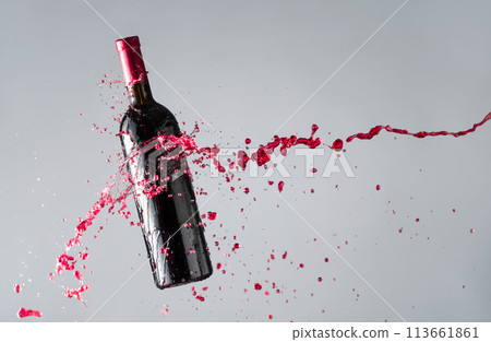 Bottle of red wine and splashes. 113661861