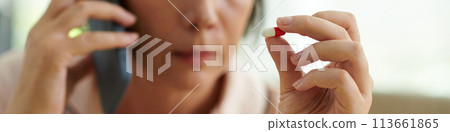Web banner with sick mature woman calling doctor before taking pill Web banner with sick mature woman calling doctor before taking pill 113661865