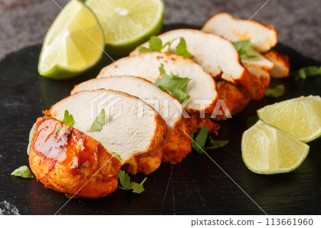 Homemade Grilled Chipotle Chicken Breast with Cilantro and LIme closeup on a slate plate. Horizontal Homemade Grilled Chipotle Chicken Breast with Cilantro and LIme closeup on a slate plate. Horizontal 113661960