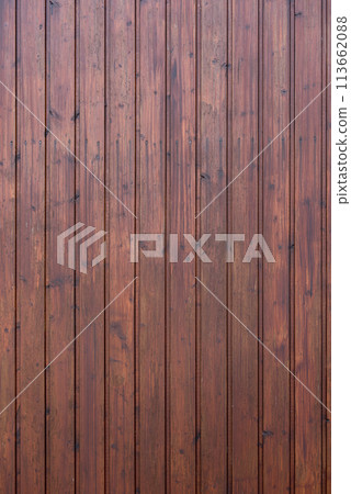 Background. wall made of wooden slats painted brownish red 113662088