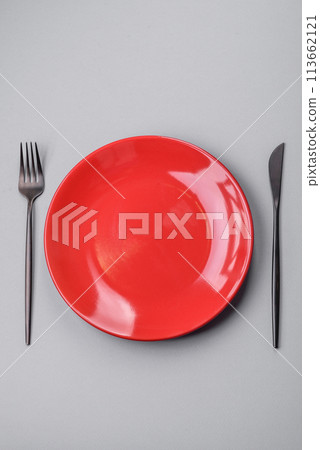An empty plate on a gray concrete background with copy space 113662121