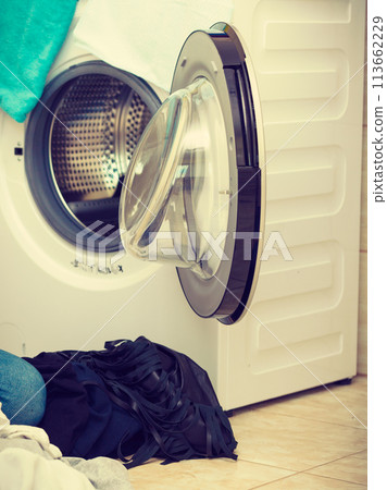 Pile of dirty colorful clothes 113662229