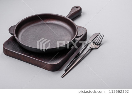 An empty plate on a gray concrete background with copy space 113662392