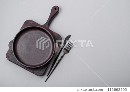 An empty plate on a gray concrete background with copy space 113662393