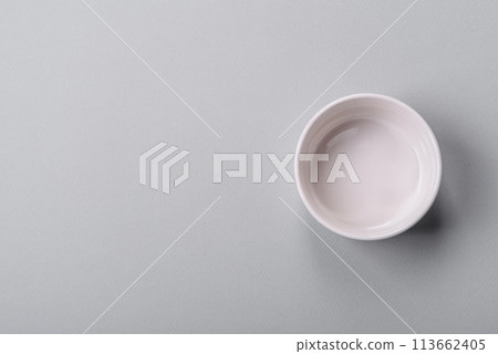 An empty plate on a gray concrete background with copy space 113662405