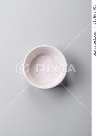 An empty plate on a gray concrete background with copy space 113662406