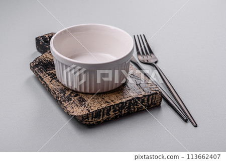 An empty plate on a gray concrete background with copy space 113662407