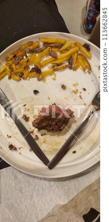 Leftover fast food on plate 113662845