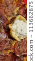 Gourmet pizza slice with creamy topping 113662875