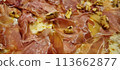 Gourmet prosciutto and walnut pizza closeup 113662877