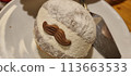 Freshly dusted italian pastry with chocolate garnish 113663533