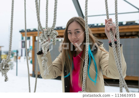 Woman Standing on Rope in Snow Woman Standing on Rope in Snow 113663955