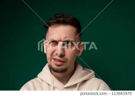 Man in a Hoodie Making a Face 113663970