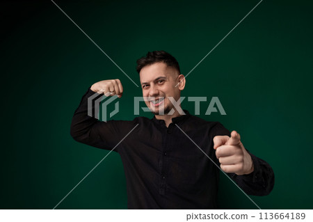 Man in Black Shirt Giving Thumbs Up 113664189