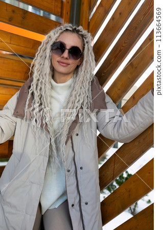 Woman With Long Blonde Hair Wearing Sunglasses Woman With Long Blonde Hair Wearing Sunglasses 113664569