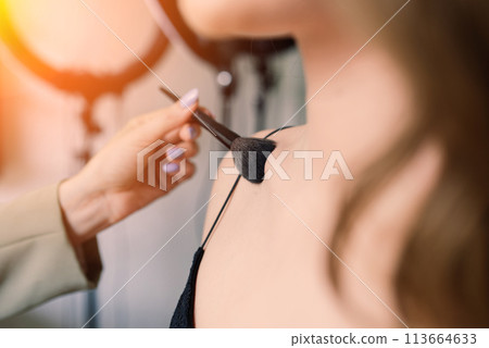 Woman make-up artist work in her studio with model Woman make-up artist work in her studio with model 113664633