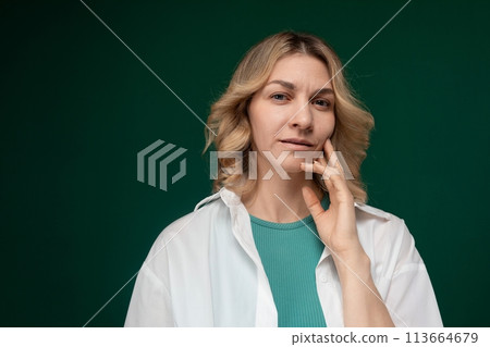 Woman in Green Shirt Posing for Picture 113664679