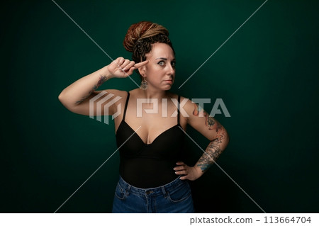 Woman in Black Top Posing for a Picture 113664704