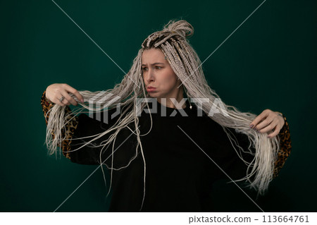 Woman Holding Her Long Hair Woman Holding Her Long Hair 113664761