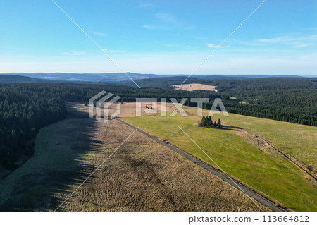 Blatna irrigation canal in the middle of autumn landscape at Ryzovna, Ore Mountains, Czech: Krusne hory, Czechia. Aerial view from drone. 113664812