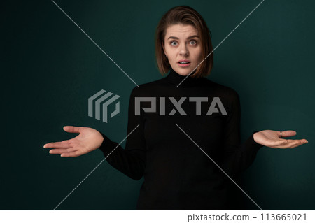 Woman in Black Shirt Holding Out Hands Woman in Black Shirt Holding Out Hands 113665021