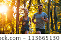 Man and Woman Running in the Woods 113665130