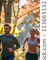 Man and Woman Running in the Woods 113665132