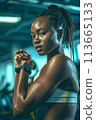 Portrait of a young black woman using a sport smartwatch 113665133
