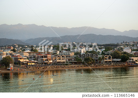 Cityscape at sunset, Agioi Apostoli, Chania, Crete, Greece. 113665146