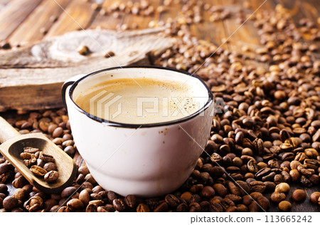Coffee in cup on wooden table in cafe Coffee in cup on wooden table in cafe 113665242