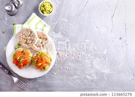 sandwiches with salmon and avocado on plate sandwiches with salmon and avocado on plate 113665279