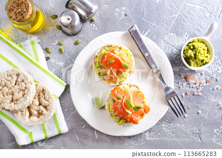 sandwiches with salmon and avocado on plate sandwiches with salmon and avocado on plate 113665283