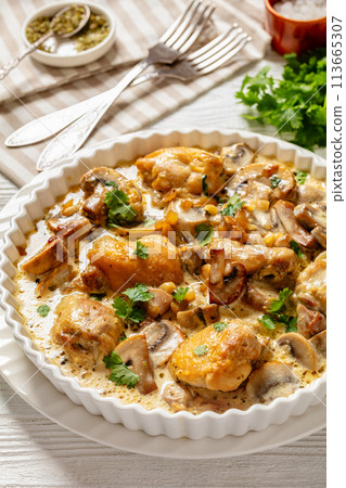 chicken thighs in a creamy mushroom garlic sauce chicken thighs in a creamy mushroom garlic sauce 113665307