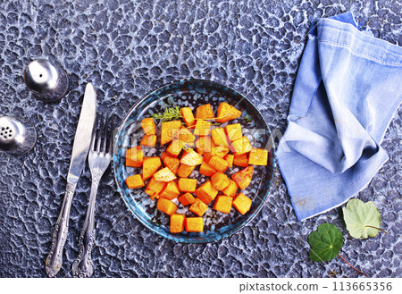 Stir-fried pumpkin on plate . Diet food 113665356