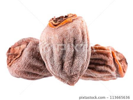 Dried persimmon isolated on white background. Dried fruit snack. Dried persimmon isolated on white background. Dried fruit snack. 113665636