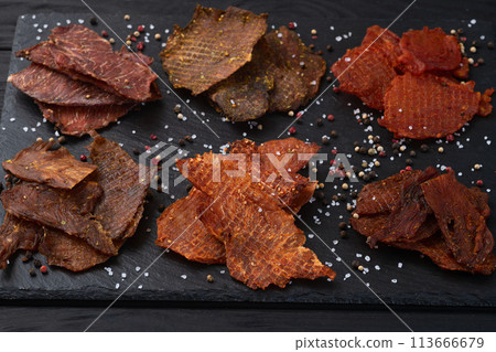 Mix of dried meat Jerky . From chicken , beef and pork. 113666679