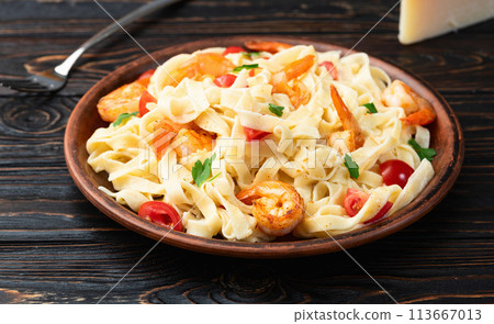 Italian pasta with shrimps , parmesan and tomatoes Italian pasta with shrimps , parmesan and tomatoes 113667013