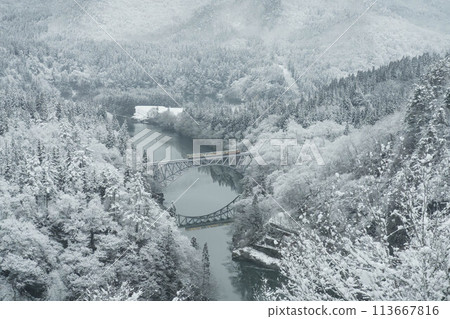 The Tadami Line running along the snowy Tadami River The Tadami Line running along the snowy Tadami River 113667816