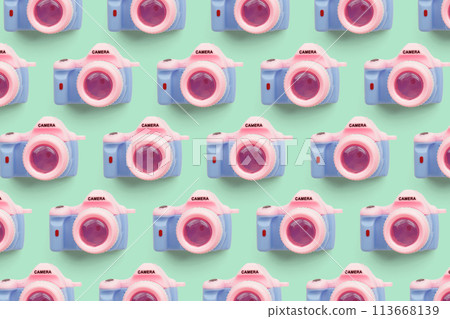 Pattern with SLR camera on pastel color background Pattern with SLR camera on pastel color background 113668139