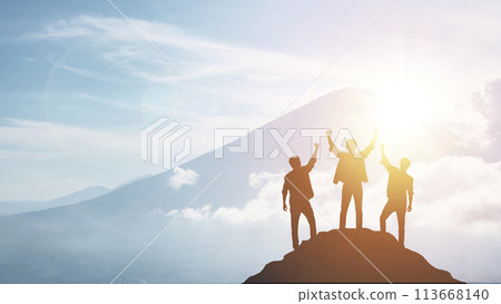Silhouette of a team celebrating a victory against sunset background, concept of victory and leadership 113668140
