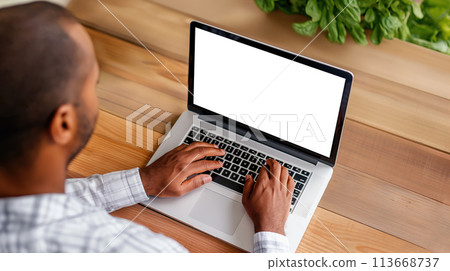 Mastering Productivity, Man Typing on a Laptop on a Wooden Desk, Top View, Generative AI 113668737
